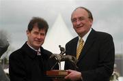 25 April 2002; Winning trainer J.P. McManus, left, is presented with the trophy by former T.D. Sean Barrett, after Moratorium's win in the Sean Barrett Bloodstock Insurances Handicap Hurdle at Punchestown Racecourse in Naas, Kildare. Photo by Aoife Rice/Sportsfile