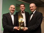 26 April 2002; The UCD player manager Paul Doolin is presented with the eircom Soccer Writers Association of Ireland Personality of the Year Award by Brendan Nevin, right, Marketing Director, eircom, and the Association's President Paul Lennon before an awards banquet in The Conrad Hotel, Dublin. Photo by David Maher/Sportsfile