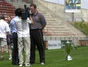 26 April 2002; Munster captain Mick Galwey is interviewed with the Heineken Cup in the background by French TV at a press conference at the Stade De La Mediterranee, Bezier, France. Photo by Matt Browne/Sportsfile