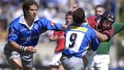 27 April 2002; Alan Quinlan of Munster in action against Alexandre Albouy, 9, and Ugo Mola of Castres during the Heineken European Cup Semi-Final match between Castres and Munster at Stade de la Mediterranie in Beziers, France. Photo by Brendan Moran/Sportsfile