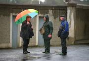 27 April 2002; Ticket sellers brave the conditions as they wait for the spectators to arrive prior to the Guinness Leinster Senior Hurling Championship First Round match between Wicklow and Laois at the County Grounds in Aughrim, Wicklow. Photo by Aoife Rice/Sportsfile