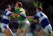 28 April 2002; Noel Kennelly of Kerry is tackled by Tom Kelly, left and Kevin Fitzpatrick of Laois during the Allianz National Football League Division 2 Final match between Kerry and Laois at the Gaelic Grounds in Limerick. Photo by Brendan Moran/Sportsfile