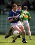 28 April 2002; Brian McDonald of Laois is tackled by Tom Sullivan of Kerry during the Allianz National Football League Division 2 Final match between Kerry and Laois at the Gaelic Grounds in Limerick. Photo by Brendan Moran/Sportsfile