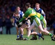 28 April 2002; Chris Conway of Laois is tackled by Marc Ó Sé of Kerry during the Allianz National Football League Division 2 Final match between Kerry and Laois at the Gaelic Grounds in Limerick. Photo by Brendan Moran/Sportsfile