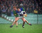 28 April 2002; Ian Fitzgerald of Laois is tackled by Seamus Scanlon of Kerry during the Allianz National Football League Division 2 Final match between Kerry and Laois at the Gaelic Grounds in Limerick. Photo by Brendan Moran/Sportsfile