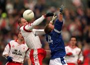 28 April 2002; Chris Lawn of Tyrone in action against Jason Reilly of Cavan during the Allianz National Football League Division 1 Final match between Tyrone and Cavan at St Tiernach's Park in Clones, Monaghan. Photo by Damien Eagers/Sportsfile