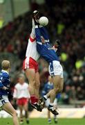 28 April 2002; Colin Holmes of Tyrone in action against  Cathal Collins of Cavan during the Allianz National Football League Division 1 Final match between Tyrone and Cavan at St Tiernach's Park in Clones, Monaghan. Photo by Damien Eagers/Sportsfile