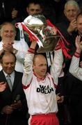 28 April 2002; Tyrone captain Peter Canavan lifts the cup after the Allianz National Football League Division 1 Final match between Tyrone and Cavan at St Tiernach's Park in Clones, Monaghan. Photo by Damien Eagers/Sportsfile