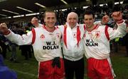 28 April 2002; Tyrone players Stephen O'Neill, left, and Brian Robinson celebrate with Tyrone supporter Brendan McCann after the Allianz National Football League Division 1 Final match between Tyrone and Cavan at St Tiernach's Park in Clones, Monaghan. Photo by Damien Eagers/Sportsfile