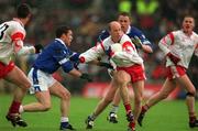 28 April 2002; Peter Canavan of Tyrone in action against Eamonn Reilly of Cavan during the Allianz National Football League Division 1 Final match between Tyrone and Cavan at St Tiernach's Park in Clones, Monaghan. Photo by Damien Eagers/Sportsfile