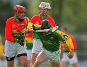 28 April 2002; Ray Dorran of Meath in action against Pat Coady of Carlow during the Guinness Leinster Senior Hurling Championship First Round match between Carlow and Meath at Dr Cullen Park in Carlow. Photo by Ray McManus/Sportsfile