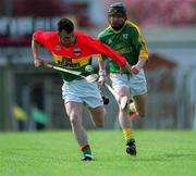 28 April 2002; Johnny Nevin of Carlow is tackled by Thomas Reilly of Meath during the Guinness Leinster Senior Hurling Championship First Round match between Carlow and Meath at Dr Cullen Park in Carlow. Photo by Ray McManus/Sportsfile