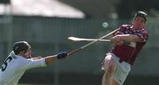 28 April 2002; Andrew Mitchell of Westmeath is tackled by Kildare's Eamonn Denieffe of Kildare during the Guinness Leinster Senior Hurling Championship First Round match between Westmeath and Kildare at Cusack Park in Mullingar, Westmeath. Photo by Aoife Rice/Sportsfile