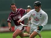 28 April 2002; Tony Spain of Kildare is tackled by Alfie Devine of Westmeath during the Guinness Leinster Senior Hurling Championship First Round match between Westmeath and Kildare at Cusack Park in Mullingar, Westmeath. Photo by Aoife Rice/Sportsfile