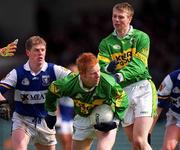 28 April 2002; Séamus Scanlon of Kerry, supported by team-mate Tomás Ó Sé, is challenged by Brian McDonald of Laois during the Allianz National Football League Division 2 Final match between Kerry and Laois at the Gaelic Grounds in Limerick. Photo by Brendan Moran/Sportsfile