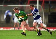 28 April 2002; Mike Frank Russell of Kerry in action against Paul McDonald of Laois during the Allianz National Football League Division 2 Final match between Kerry and Laois at the Gaelic Grounds in Limerick. Photo by Brendan Moran/Sportsfile
