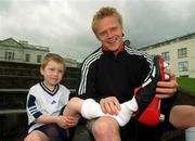 29 April 2002; Republic of Ireland International Damien Duff with 5 year old Liam Scully, from Swords, at the launch of The adidas Predator Mania football boot at The Radisson Hotel in Dublin. Photo by David Maher/Sportsfile
