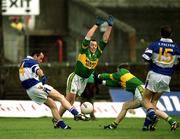 28 April 2002; Greg Ramsbottom of Laois shoots under pressure from Séamus Moynihan, left, and Marc Ó Sé of Kerry during the Allianz National Football League Division 2 Final match between Kerry and Laois at the Gaelic Grounds in Limerick. Photo by Brendan Moran/Sportsfile