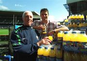 30 April 2002; Republic of Ireland International Niall Quinn with team physio Mick Byrne at Lansdowne Road when a consignment of Lucozade Sport stocks was dispatched to Japan and Korea in time for the 2002 FIFA World Cup. Photo by Ray McManus/Sportsfile