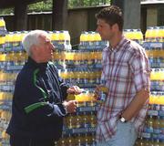 30 April 2002; Republic of Ireland International Niall Quinn with team physio Mick Byrne at Lansdowne Road when a consignment of Lucozade Sport stocks was dispatched to Japan and Korea in time for the 2002 FIFA World Cup. Photo by Ray McManus/Sportsfile