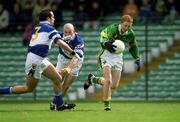 28 April 2002; Colm Cooper of Kerry goes past the challenge of Laois defenders Tom Kelly and Pauraic Leonard, left, on his way to scoring his side's first goal during the Allianz National Football League Division 2 Final match between Kerry and Laois at the Gaelic Grounds in Limerick. Photo by Brendan Moran/Sportsfile