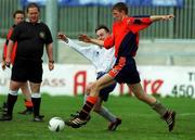 20 April 2002; John Cousins of Cheeverstown challenges Philip Doyle of Kare during the Special Olympics Ireland / eircom National Cup Final match between Cheeverstown and Kare at Richmond Park in Dublin. Photo by Pat Murphy/Sportsfile