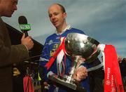 28 April 2002; Tyrone captain Peter Canavan, wearing a Cavan jersey, is interviewed by TG4 after the Allianz National Football League Division 1 Final match between Tyrone and Cavan at St Tiernach's Park in Clones, Monaghan. Photo by Damien Eagers/Sportsfile