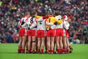 28 April 2002; Tyrone players in a huddle prior to the Allianz National Football League Division 1 Final match between Tyrone and Cavan at St Tiernach's Park in Clones, Monaghan. Photo by Pat Murphy/Sportsfile