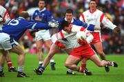 28 April 2002; Brian Robinson of Tyrone in action against Larry Reilly and Mickey Graham, 15, of Cavan during the Allianz National Football League Division 1 Final match between Tyrone and Cavan at St Tiernach's Park in Clones, Monaghan. Photo by Pat Murphy/Sportsfile