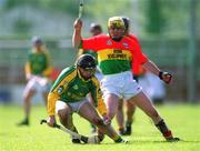 28 April 2002; Declan Murray of Meath in action against Damien Roberts of Carlow during the Guinness Leinster Senior Hurling Championship First Round match between Carlow and Meath at Dr Cullen Park in Carlow. Photo by Ray McManus/Sportsfile
