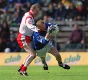 28 April 2002; Jason Reilly of Cavan in action against Chris Lawn of Tyrone during the Allianz National Football League Division 1 Final match between Tyrone and Cavan at St Tiernach's Park in Clones, Monaghan. Photo by Damien Eagers/Sportsfile