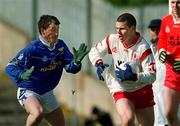 28 April 2002; Conor Gormley of Tyrone in action against Eddie Reilly of Cavan during the Allianz National Football League Division 1 Final match between Tyrone and Cavan at St Tiernach's Park in Clones, Monaghan. Photo by Damien Eagers/Sportsfile