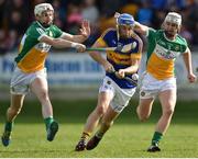 2 April 2017; John McGrath of Tipperary in action against Dermott Short, left, and Michael Cleary of Offaly during the Allianz Hurling League Division 1 Quarter-Final match between Offaly and Tipperary at O'Connor Park in Tullamore, Co Offaly. Photo by David Maher/Sportsfile