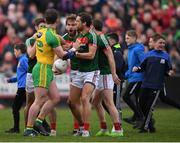 2 April 2017; Aidan O'Shea of Mayo exchanges views with Patrick McBrearty of Donegal as supporters come onto the pitch prior to the final whistle during the Allianz Football League Division 1 Round 7 match between Mayo and Donegal at Elverys MacHale Park in Castlebar, Co Mayo. Photo by Stephen McCarthy/Sportsfile