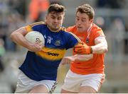2 April 2017; Michael Quinlivan of Tipperary  in action against Charlie Vernon of Armagh  during the Allianz Football League Division 3 Round 7 match between Armagh and Tipperary at the Athletic Grounds in Armagh. Photo by Oliver McVeigh/Sportsfile