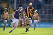 2 April 2017; Colin Fennelly of Kilkenny races clear of Diarmuid O’Keeffe of Wexford during the Allianz Hurling League Division 1 Quarter-Final match between Kilkenny and Wexford at Nowlan Park in Kilkenny. Photo by Brendan Moran/Sportsfile