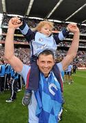 18 September 2011; Alan Brogan, Dublin, with his son Jamie, aged 2, celebrates victory after the game. GAA Football All-Ireland Senior Championship Final, Kerry v Dublin, Croke Park, Dublin. Picture credit: Ray McManus / SPORTSFILE
