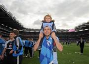 18 September 2011; Alan Brogan, Dublin, carries his son Jamie, aged 2, on his shoulders as he celebrates victory after the game. GAA Football All-Ireland Senior Championship Final, Kerry v Dublin, Croke Park, Dublin. Picture credit: Brian Lawless / SPORTSFILE
