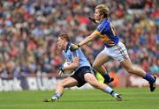 18 September 2011; John Small, Dublin, is fouled by Adrian McGuire, Tipperary. GAA Football All-Ireland Minor Championship Final, Tipperary v Dublin, Croke Park, Dublin. Picture credit: Barry Cregg / SPORTSFILE
