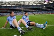 18 September 2011;  Dublin players, Declan Lally, left and Bernard Brogan sit on the pitch after the game. GAA Football All-Ireland Senior Championship Final, Kerry v Dublin, Croke Park, Dublin. Picture credit: David Maher / SPORTSFILE
