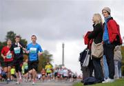 17 September 2011; Spectators watch on during the National Lottery Half Marathon. Phoenix Park, Dublin. Picture credit: Stephen McCarthy / SPORTSFILE