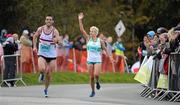 17 September 2011; Lorraine Manning, Raheny Shamrocks A.C., on her way to finishing in third position alongside David Sweeney, Civil Service Harriers, during the National Lottery Half Marathon. Phoenix Park, Dublin. Picture credit: Stephen McCarthy / SPORTSFILE