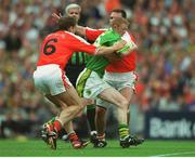 22 September 2002; Colm Cooper, Kerry, is tackled by Kieran McGeeney (6) and Enda McNulty, Armagh. Kerry v Armagh, All Ireland Football Final, Croke Park, Dublin. Picture credit; Ray McManus / SPORTSFILE