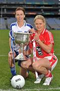 20 September 2011; Ahead of the TG4 Ladies Football All-Ireland Finals taking place this Sunday in Croke Park, the captains and managers from all six competing counties met in Crokes Park. Cork captain Amy O'Shea, right, and Monaghan captain Sharon Courtney, with the Brendan Martin Cup ahead of the TG4 Senior Final which throws in at 4pm. 2011 TG4 All-Ireland Ladies Football Final Captain's Day, Croke Park, Dublin. Picture credit: David Maher / SPORTSFILE