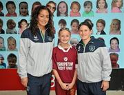 20 September 2011; Fiona O'Sullivan, left, and Shannon Smith, Republic of Ireland, with Grace O'Leary, age 12, from Ballyhass, Cork, during the senior women’s team visit to Douglas Village Shopping Centre, Cork, ahead of their UEFA EURO 2013 qualifier against France which takes place on Thursday, September 22nd in Turners Cross, Cork, at 7.45pm. Douglas Village Shopping Centre, Cork. Picture credit: Diarmuid Greene / SPORTSFILE