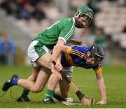 5 April 2017; Niall Hoctor of Tipperary action against Michael O'Grady of Limerick during the Electric Ireland Munster Minor Hurling Championship Quarter-Final match between Tipperary and Limerick at Semple Stadium in Thurles, Co. Tipperary. Photo by David Maher/Sportsfile
