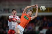 5 April 2017; Rian O'Neill of Armagh in action against Conor McGrogan of Derry during the EirGrid Ulster GAA Football U21 Championship Semi-Final match between Derry and Armagh at Celtic Park in Derry. Photo by Oliver McVeigh/Sportsfile