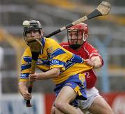 13 July 2005; Killian Clancy, Clare, in action against Pat Fitzgerald, Cork. Erin Munster Under 21 Hurling Championship Semi-final, Clare v Cork, Semple Stadium, Thurles, Co. Tipperary. Picture credit; Matt Browne / SPORTSFILE