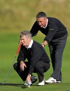 14 September 2011; Michael Gaynor, County Meath Golf Club, Co. Meath, right, and Frank Houlding, caddie, during the Junior Cup Semi-Final. Chartis Cups and Shields Finals 2011, Castlerock Golf Club, Co. Derry. Picture credit: Oliver McVeigh/ SPORTSFILE