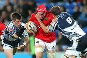 23 September 2011; Tommy O'Donnell, Munster, is tackled by Ceri Sweeney, left, and Xavier Rush, Cardiff Blues. Celtic League, Cardiff Blues v Munster, Cardiff City Stadium, Cardiff, Wales. Picture credit: Steve Pope / SPORTSFILE